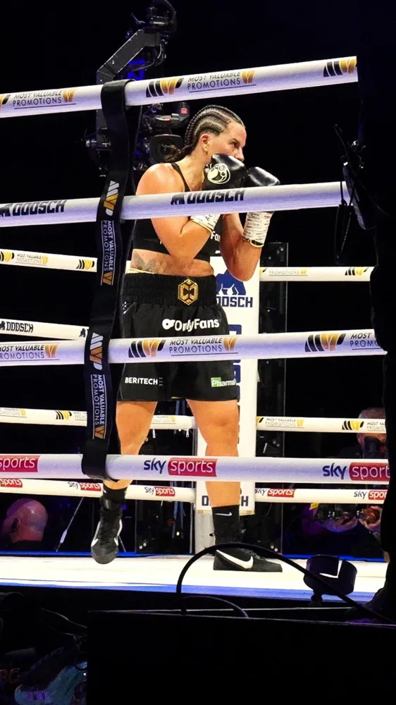 Boxer preparing in the ring at a live event