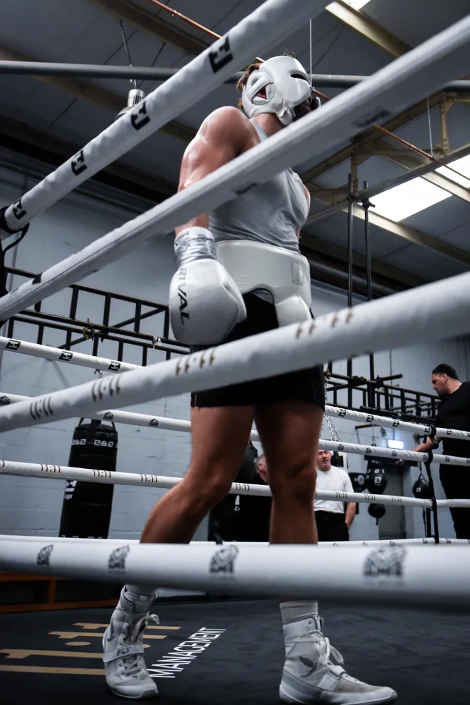 Boxer taking a break beside the ring ropes