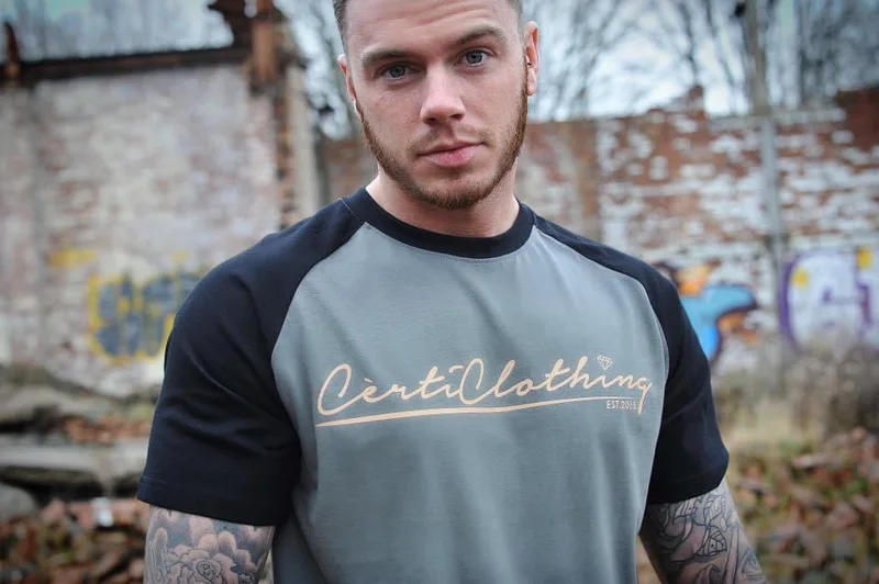 Close-up of a branded grey and black T-shirt
