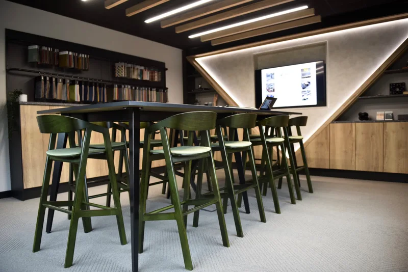 Interior showroom with green stools and material samples
