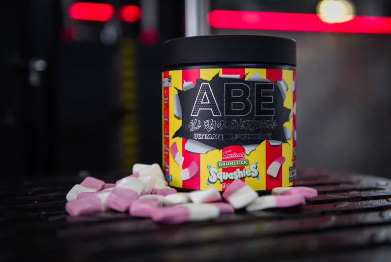 Pre-workout product photographed with pink and white sweets