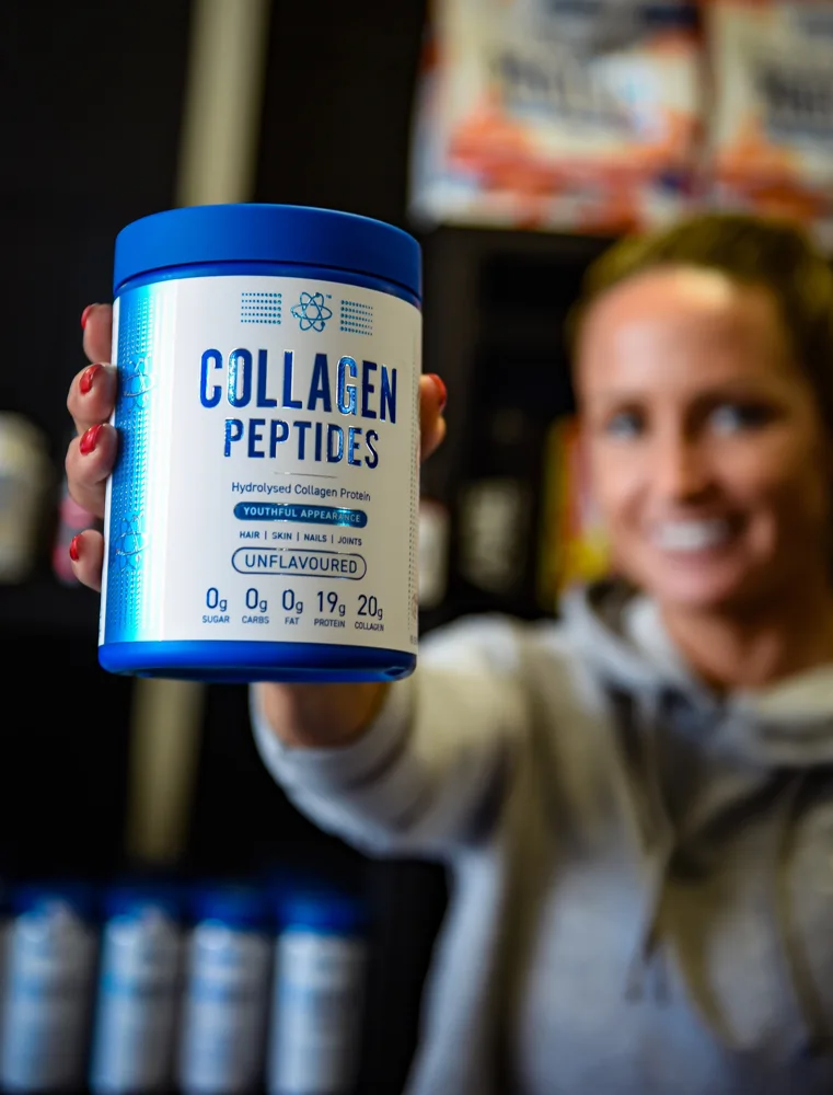 Woman holding a collagen peptides product