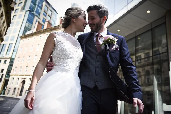 Newlyweds walking together through the city