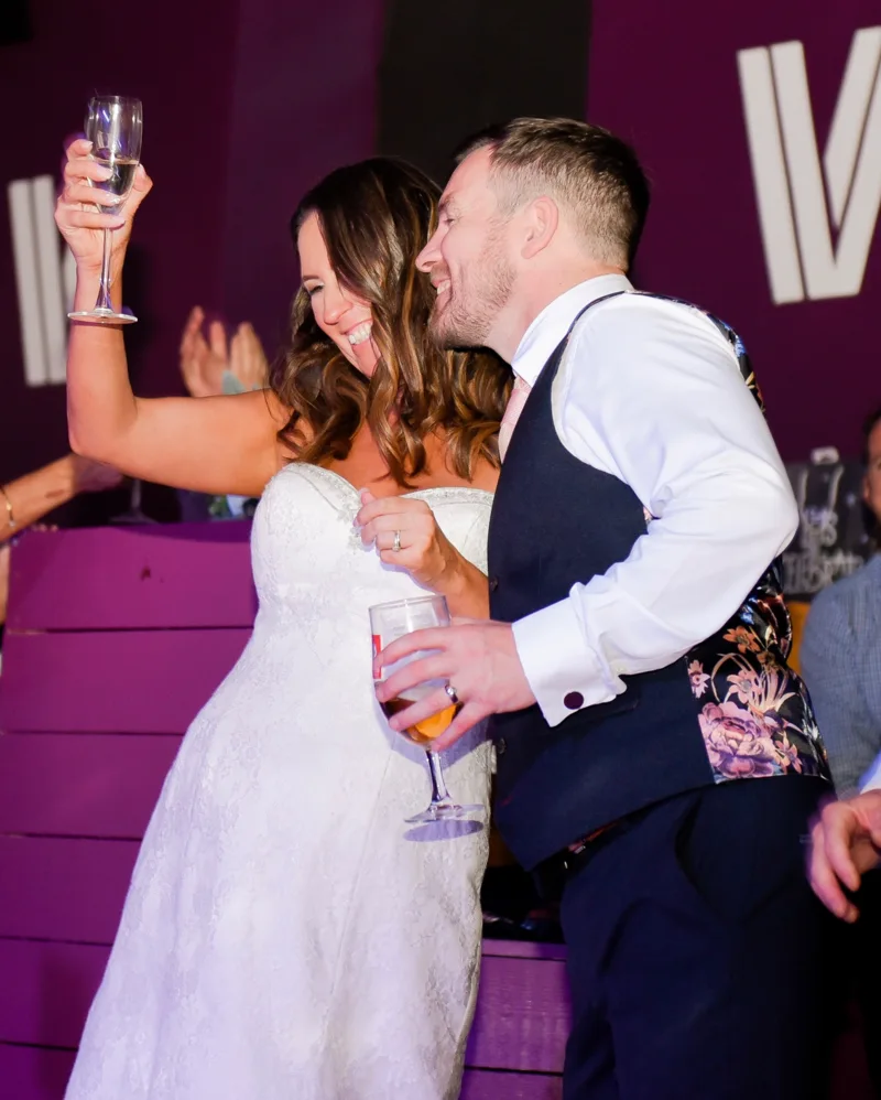 Newlyweds celebrating together at their reception