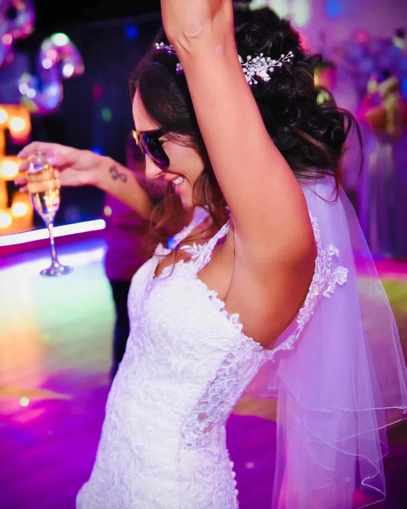 Bride celebrating on the dance floor