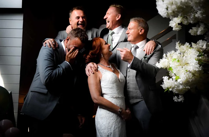 Wedding party sharing a moment of laughter